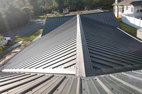 pull metal roof.panels.onto house|metal roofing panels.